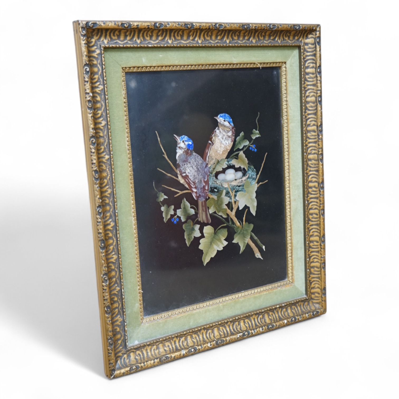 A 19th century Italian pietra dura panel decorated with nesting birds, framed. Panel 20cm wide x 28cm high. Condition - good